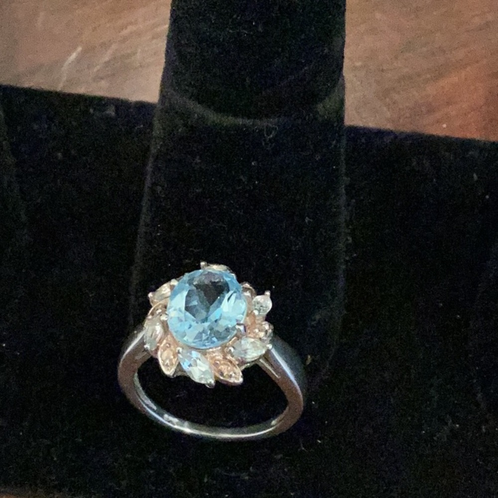 Topaz stone encircled by cubic zirconia stones